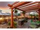 Backyard with a cozy seating area and a hot tub beneath an elegant pergola at 21492 E 60Th Ave, Aurora, CO 80111