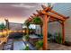 Backyard pergola covered patio with hot tub and inviting seating area at 21492 E 60Th Ave, Aurora, CO 80111