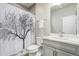 Bathroom features a shower with a tree-themed curtain and a modern vanity at 21492 E 60Th Ave, Aurora, CO 80111