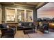 Charming covered patio with wicker furniture and a view of the backyard at 21492 E 60Th Ave, Aurora, CO 80111