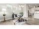 Contemporary dining area highlighted by a glass table, comfortable seating, and a bright, inviting atmosphere at 21492 E 60Th Ave, Aurora, CO 80111