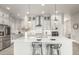 Well-appointed kitchen with quartz countertops, stainless steel appliances, sleek cabinetry, and ample island seating at 21492 E 60Th Ave, Aurora, CO 80111