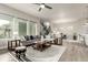 Bright and airy living room featuring an open layout, stylish furnishings, and seamless flow to the dining area at 21492 E 60Th Ave, Aurora, CO 80111
