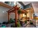 Inviting outdoor patio with pergola, fire pit, and comfortable seating area at 21492 E 60Th Ave, Aurora, CO 80111