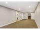 Spacious basement with recessed lighting, ready to be customized for entertainment or relaxation at 5514 Uinta St, Denver, CO 80238