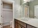 Well-lit bathroom with a large mirror, a single sink, and shower-tub combination at 5514 Uinta St, Denver, CO 80238