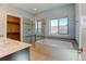 Bright bathroom with dual sinks, soaking tub, and glass-enclosed shower at 5514 Uinta St, Denver, CO 80238