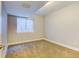 Minimalist bedroom with carpet, a window and base trim at 5514 Uinta St, Denver, CO 80238