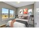 Cozy bedroom featuring abundant natural light and stylish decor at 5514 Uinta St, Denver, CO 80238