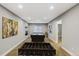 Spacious game room with a pool table, foosball, and stylish decor at 5514 Uinta St, Denver, CO 80238