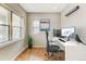 Home office with hardwood floors, desk, ergonomic chair, and natural light at 5514 Uinta St, Denver, CO 80238