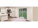 Bright kitchen features white cabinets, stainless appliances, and sliding glass door at 22363 E 38Th Pl, Aurora, CO 80019