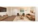 Living room with a TV, large window, comfortable seating, and neutral decor at 22363 E 38Th Pl, Aurora, CO 80019