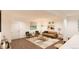 Open-concept living room with large window, comfortable seating, and neutral decor at 22363 E 38Th Pl, Aurora, CO 80019