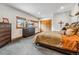 Cozy bedroom with a king-sized bed, dresser, and windows with views of the lake at 384 Camron Ln, Breckenridge, CO 80424