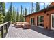 Relax on this deck with comfy furniture, perfect for enjoying the outdoors at 384 Camron Ln, Breckenridge, CO 80424