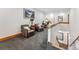 Upper hallway features two leather chairs, a desk, and a staircase down to the main floor at 384 Camron Ln, Breckenridge, CO 80424