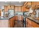 Modern kitchen featuring stainless steel appliances, granite countertops, and custom wood cabinets at 384 Camron Ln, Breckenridge, CO 80424