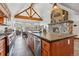 Open-concept kitchen with a stone fireplace, vaulted ceiling, and panoramic mountain views at 384 Camron Ln, Breckenridge, CO 80424