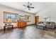 Inviting living room with large windows offering views of the forest, comfortable seating, and tile floors at 384 Camron Ln, Breckenridge, CO 80424