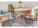 Spacious great room with a stone fireplace, open kitchen and dining area, and vaulted ceilings at 384 Camron Ln, Breckenridge, CO 80424