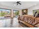 Spacious main bedroom with a stone fireplace, rustic wood furniture, and sliding doors to a deck with mountain views at 384 Camron Ln, Breckenridge, CO 80424