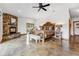 Spacious main bedroom with a stone fireplace, rustic furniture, a ceiling fan, and neutral decor at 384 Camron Ln, Breckenridge, CO 80424