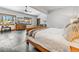 Bright main bedroom features a king bed, dresser, and multiple windows with natural views at 384 Camron Ln, Breckenridge, CO 80424
