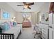 Bright bedroom with desk and daybed at 145 Willowleaf Dr, Littleton, CO 80127