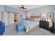 Spacious primary bedroom with a barn door and natural light at 145 Willowleaf Dr, Littleton, CO 80127