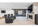 Finished basement featuring fireplace, built-in shelving, and media area at 10681 Sundial Rim Rd, Highlands Ranch, CO 80126