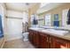 Bathroom with double vanity, shower-tub combo, and modern fixtures at 10681 Sundial Rim Rd, Highlands Ranch, CO 80126