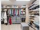 Walk-in closet with custom shelving and ample storage space at 10681 Sundial Rim Rd, Highlands Ranch, CO 80126