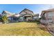 Charming two-story home with a well-manicured lawn and inviting covered front porch at 10681 Sundial Rim Rd, Highlands Ranch, CO 80126