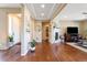 Inviting living room with hardwood floors, fireplace, and ample natural light at 10681 Sundial Rim Rd, Highlands Ranch, CO 80126
