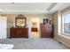 Bedroom featuring and dressers and a view into the main bathroom at 10681 Sundial Rim Rd, Highlands Ranch, CO 80126