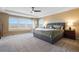 Bright and airy main bedroom featuring tray ceiling and spacious layout at 10681 Sundial Rim Rd, Highlands Ranch, CO 80126