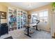 Bright office with large bookshelves and a modern workstation at 10681 Sundial Rim Rd, Highlands Ranch, CO 80126