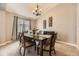 Cozy dining room with elegant chandelier, stylish furniture, and neutral décor at 17059 Motsenbocker Way, Parker, CO 80134