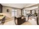 Open kitchen with a large island, stainless steel appliances, and a view into the living room at 17059 Motsenbocker Way, Parker, CO 80134