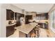 Gourmet kitchen featuring a granite island, stainless steel appliances, and modern cabinetry at 17059 Motsenbocker Way, Parker, CO 80134