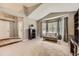 Bright living room featuring a bay window, neutral paint, and plush carpeting at 17059 Motsenbocker Way, Parker, CO 80134