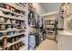 Organized walk-in closet with ample shelving and hanging space for shoes and clothing at 17059 Motsenbocker Way, Parker, CO 80134