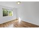 Well lit bedroom offering a window and hard wood floors at 607 Branding Iron Ln, Castle Rock, CO 80104
