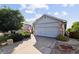 This home showcases a two-car garage and a well-maintained driveway, set against a blue sky backdrop at 607 Branding Iron Ln, Castle Rock, CO 80104