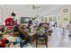 A spacious living room with tile floors and ample natural light; needs decluttering at 607 Branding Iron Ln, Castle Rock, CO 80104