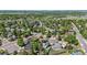 Picturesque aerial view of a leafy neighborhood showcasing well-maintained homes and tree-lined streets at 6975 S Wadsworth Ct, Littleton, CO 80128