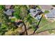 Aerial image showcasing a home with solar panels, hot tub, and a landscaped backyard with a garden at 6975 S Wadsworth Ct, Littleton, CO 80128