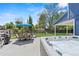 Backyard features a patio with a hot tub, dining table, and a spacious grassy area at 6975 S Wadsworth Ct, Littleton, CO 80128