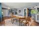 Open dining room with a hardwood floor and staircase in view at 6975 S Wadsworth Ct, Littleton, CO 80128